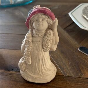 Charming Figurine with Pink Hat